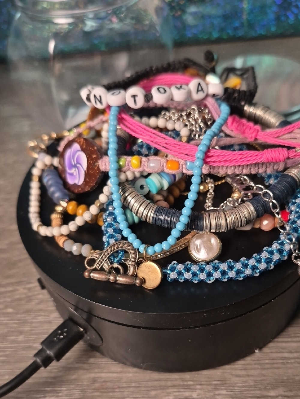 Assortment Of Bracelets. Some Braided, Some Beaded.